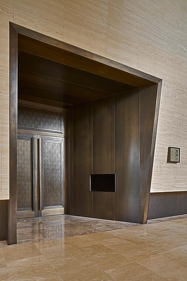 A room with a wood floor and a door.